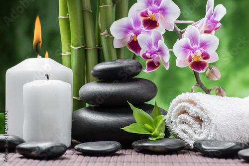 Fototapeta Naklejka Na Ścianę i Meble -  spa still life with zen basalt stones ,orchid and bamboo with candle