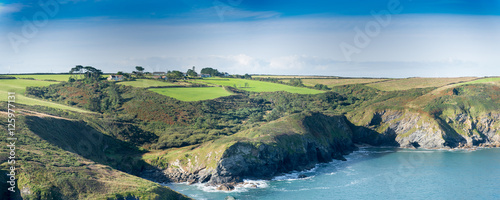 Fototapeta Naklejka Na Ścianę i Meble -  Panoramic view with farmhouses and the Epphaven cove near Port Quin in north Cornwall.