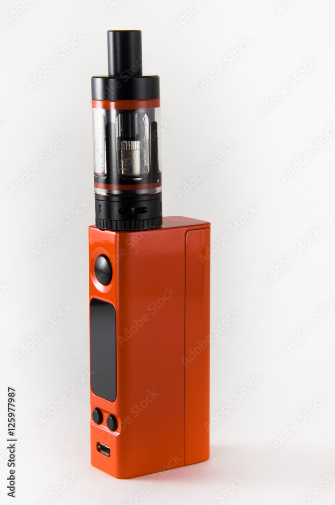 Orange E-cigarette or vaping device. Close up. Orange E-cigarette or vaping device. Close up.