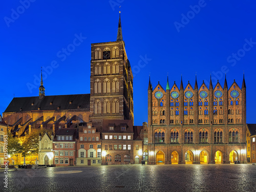 Stralsund, Germany. Night view of Old Market square with Nicholas' Church and City Hall in brick gothic style.