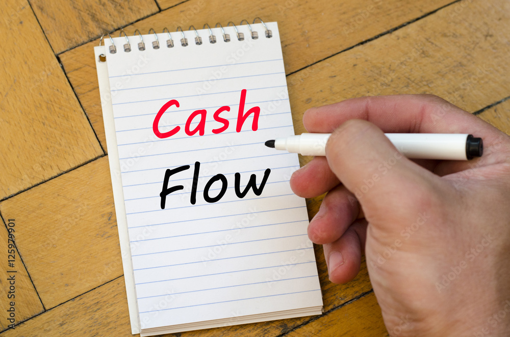 Cash flow text concept on notebook Cash flow text concept on notebook