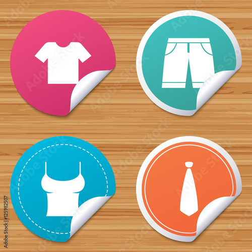 Round stickers or website banners. Clothes icons. T-shirt and bermuda shorts signs. Business tie symbol. Circle badges with bended corner. Vector