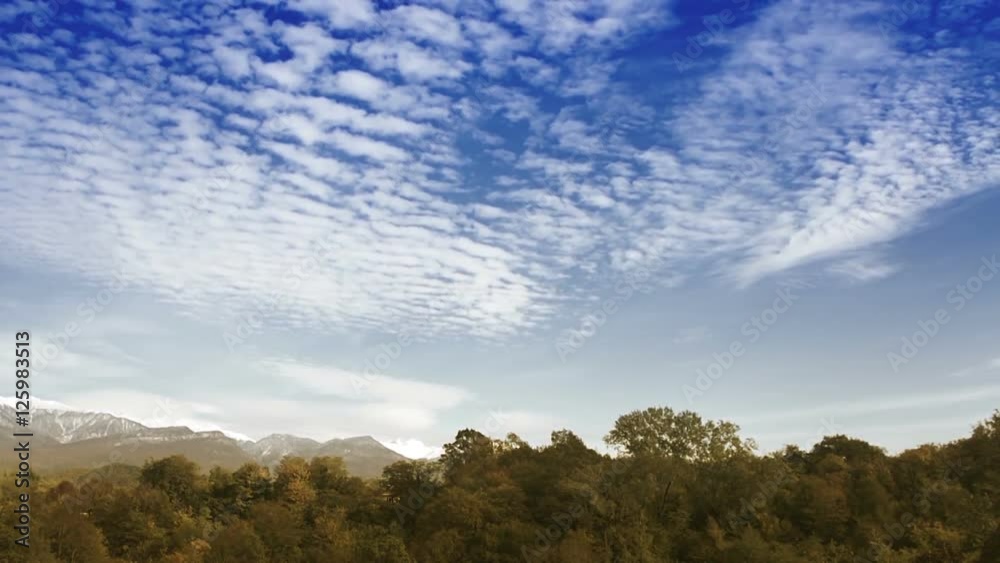 Time Lapse clouds over the autumn forest Time Lapse clouds over the autumn forest