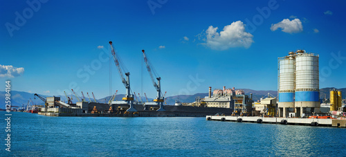 Panoramic view of cargo terminal Port Genoa with cranes, Italy