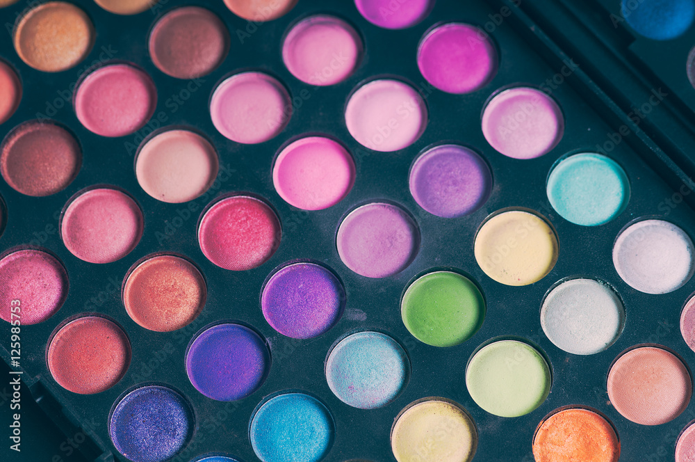 Make-up colorful eyeshadow palettes isolated on black background Make-up colorful eyeshadow palettes isolated on black background