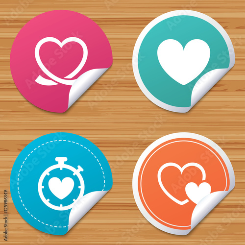 Round stickers or website banners. Heart ribbon icon. Timer stopwatch symbol. Love and Heartbeat palpitation signs. Circle badges with bended corner. Vector