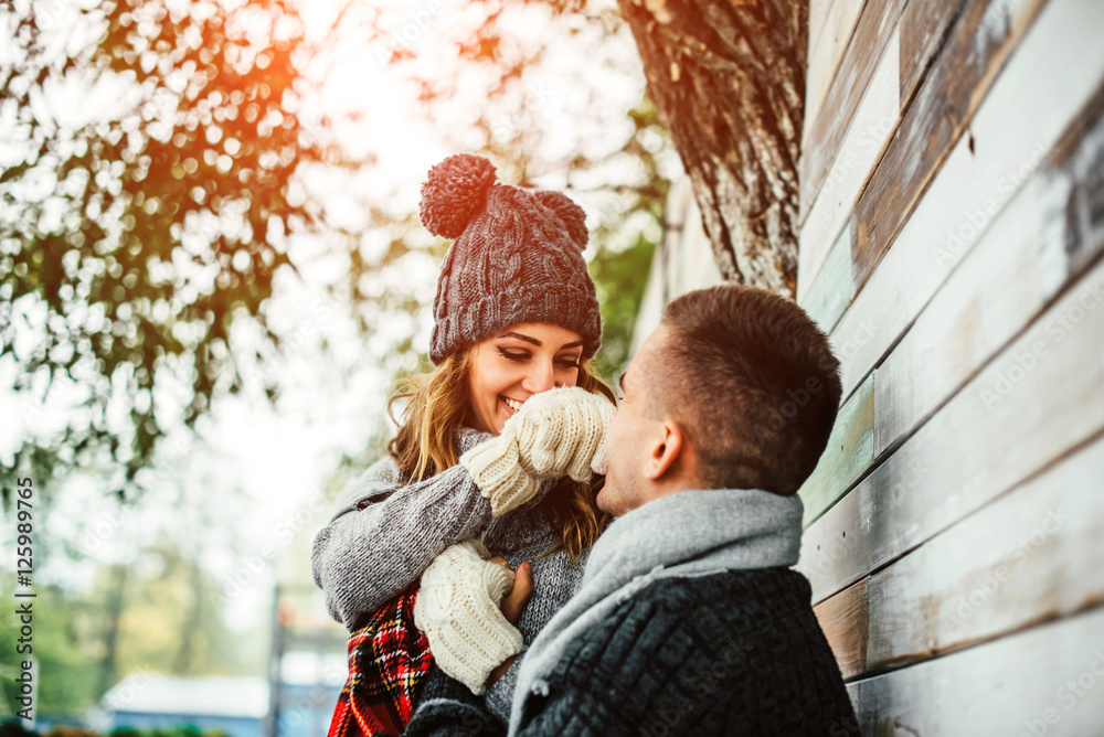 Happy young couple have fun in the park