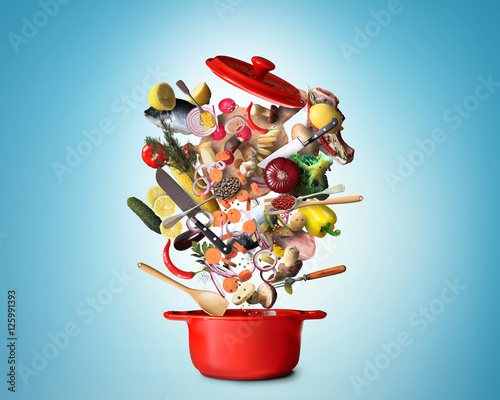 Fotografi big red pot with vegetables and meat
