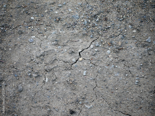 Dry soil and small rock in Thailand. This land is hard, barren,