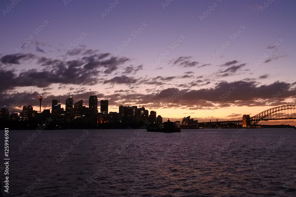 Silhouette of Sydney Skyline at dramatic sunset
