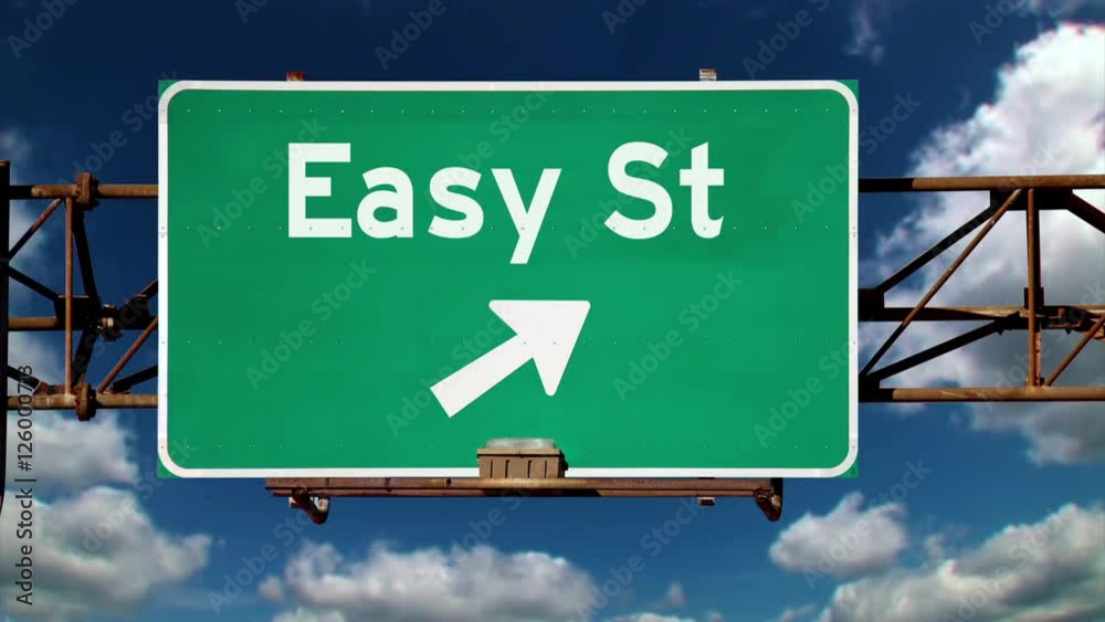 A road sign pointing to the direction of Easy Street. A road sign pointing to the direction of Easy Street.