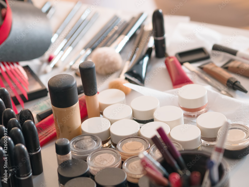 Obraz premium Various cosmetics and makeup stuff on the table, backstage