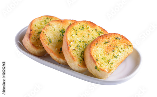 garlic bread in white plate on white background