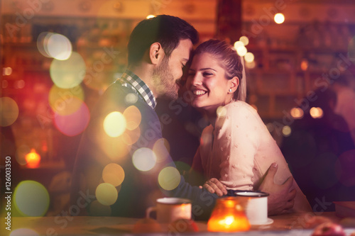 Romantic couple dating in pub photo