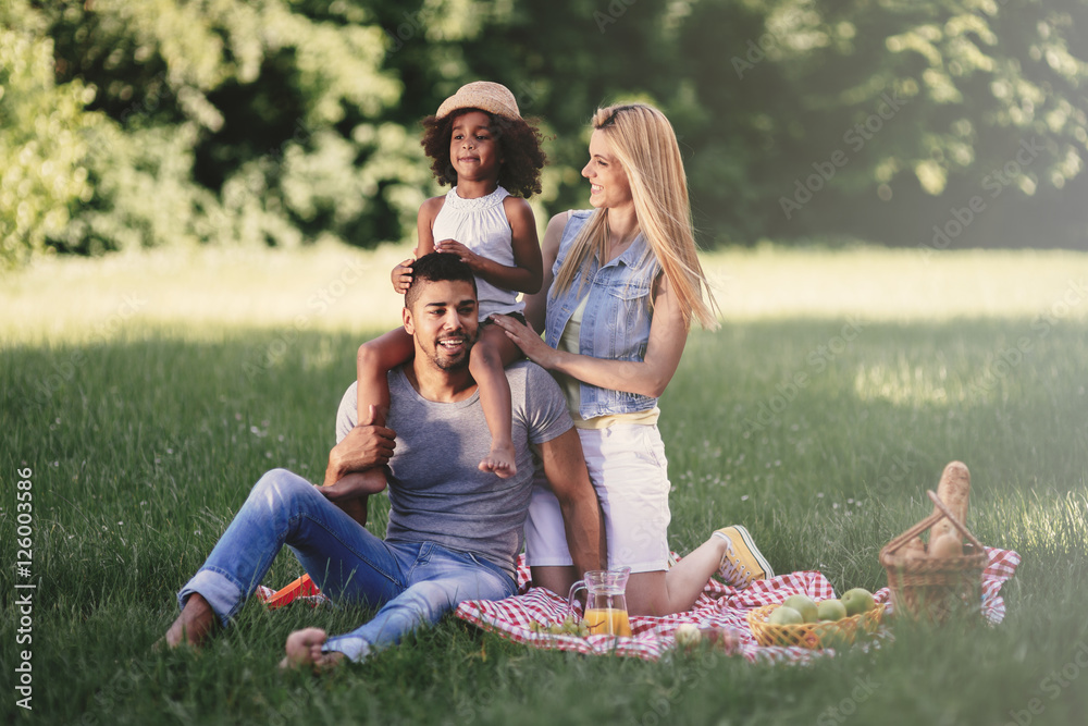 Happy family enjoying picnic Happy family enjoying picnic