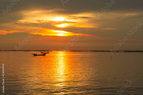 Sea evening sun at sunset. red sunlight sea and the boat © aboutnuylove