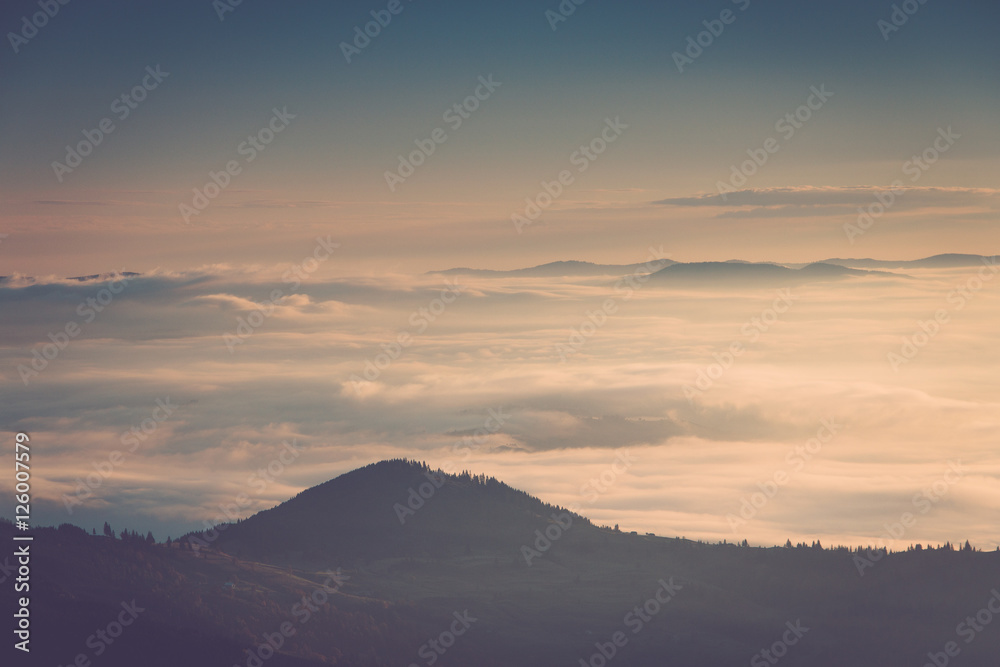 Foggy mountains at sunrise.