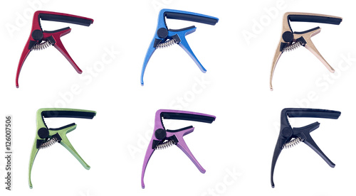 Guitar colorful capo on white background 