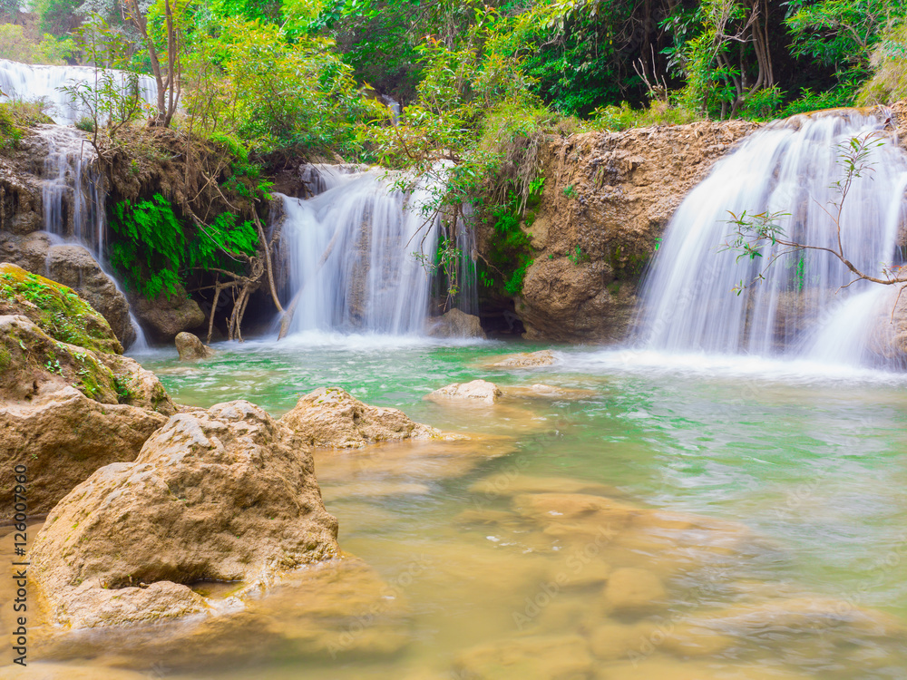 Fototapeta premium Deep forest waterfall at Namtok thi Lo Su waterfall National Park ,Umphang , Tak Province Thailand