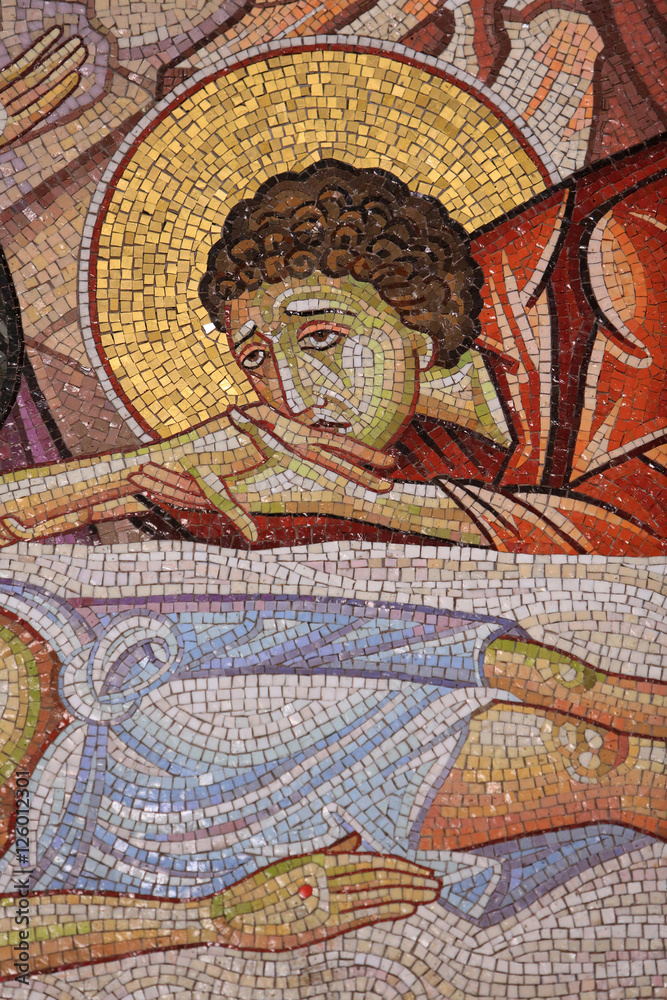 Jesus laid on the new tomb of Joseph of Arimathea. Detail of mosaic art which depicts the burial of Jesus . Holy Sepulchre Church.
