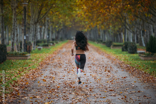 woman practicing running in the park
