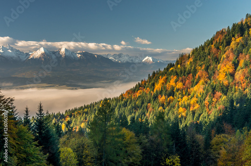Beautiful autumn panorama over colorful autumn Pieniny mountains to snowy Tatra mountains, Poland