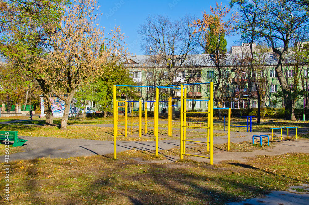 Fototapeta premium Horizontal bars on a sports ground in a park