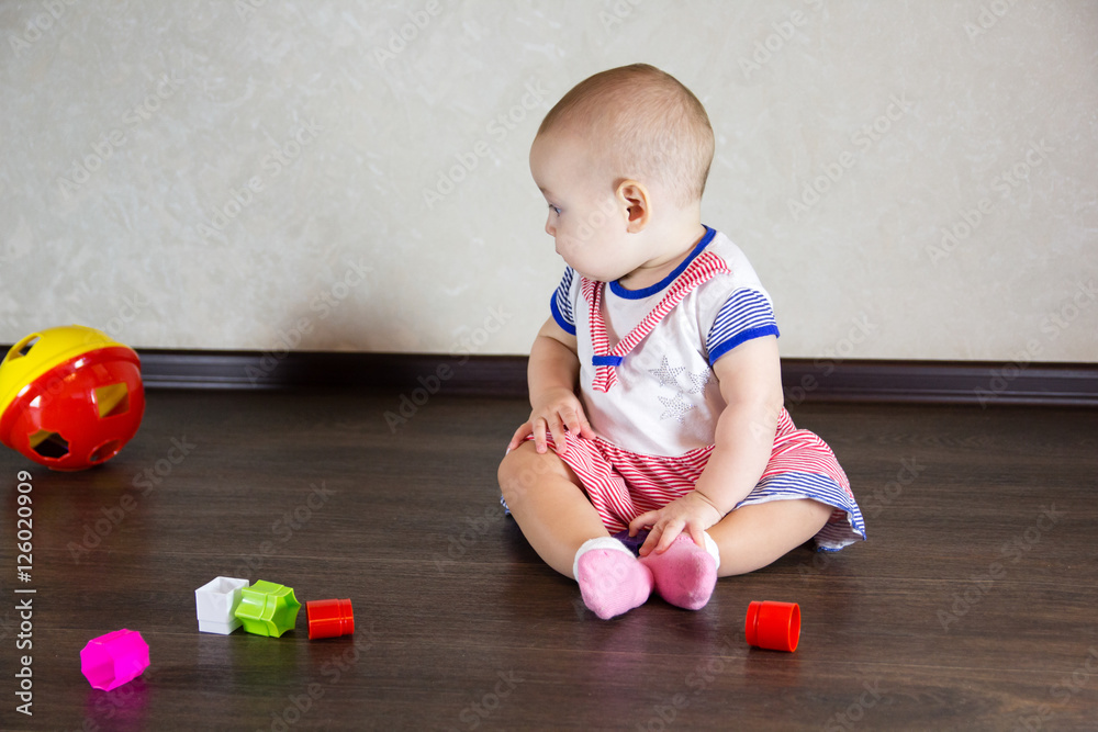 Little baby playing with toys