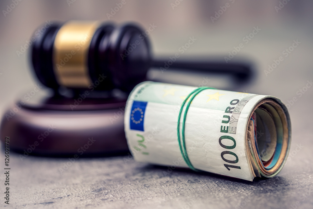 Judge's hammer gavel. Justice and euro money. Euro currency. Court gavel and rolled Euro banknotes. Representation of corruption and bribery in the judiciary. Judge's hammer gavel. Justice and euro money. Euro currency. Court gavel and rolled Euro banknotes. Representation of corruption and bribery in the judiciary.