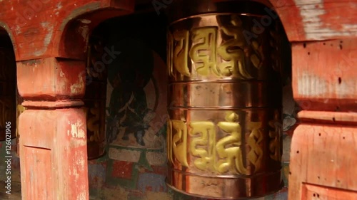 Bhutan prayerbells with engraving turning closeup  photo