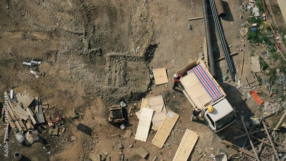 Up view on people cleaning project site for construction Up view on people cleaning project site for construction