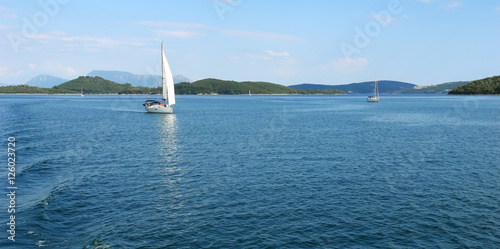 View with blue sea, islands and yachts.
