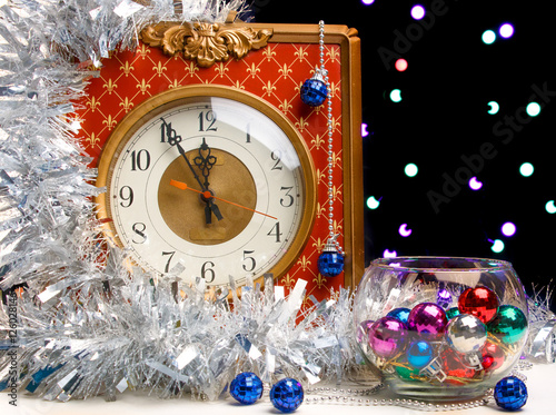 Vintage watch on a background garlands of light bulbs