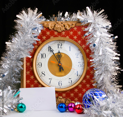 Vintage analog watch with xmas balls on dark background