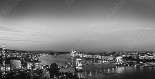 Budapest, Hungary. Aerial view on city lights, center in evening dusk. Black and white scene.