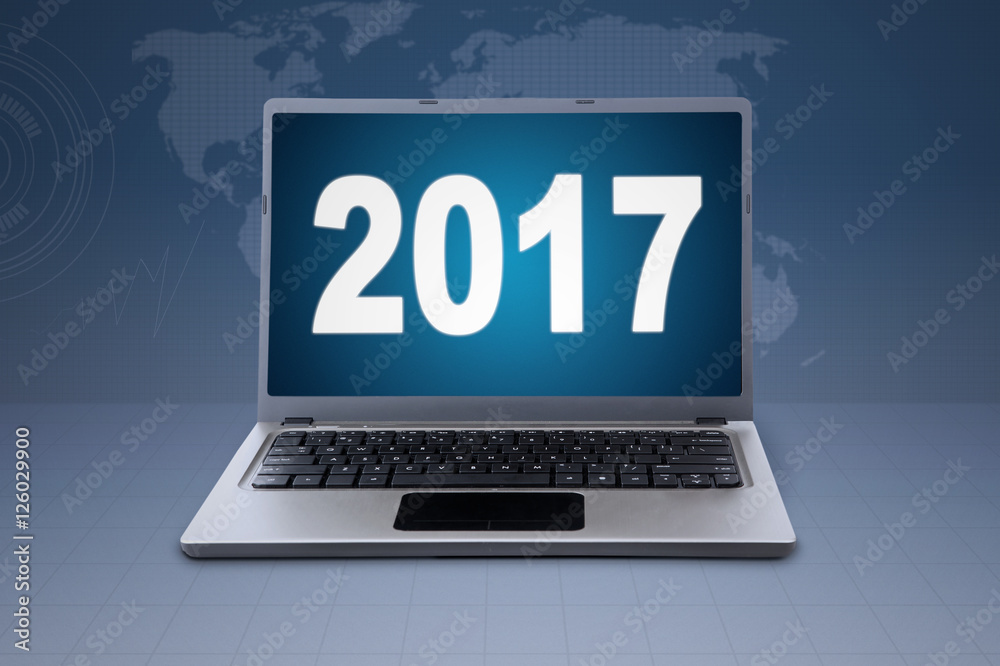 Notebook and numbers 2017 in world map background Notebook and numbers 2017 in world map background