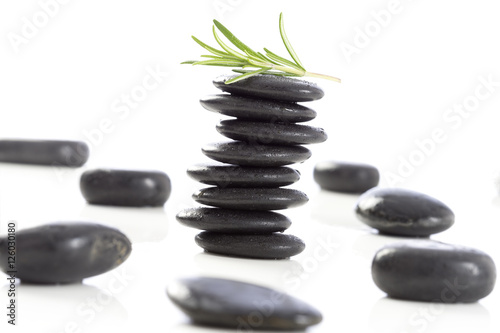 Spa stones and rosemary   isolated on white