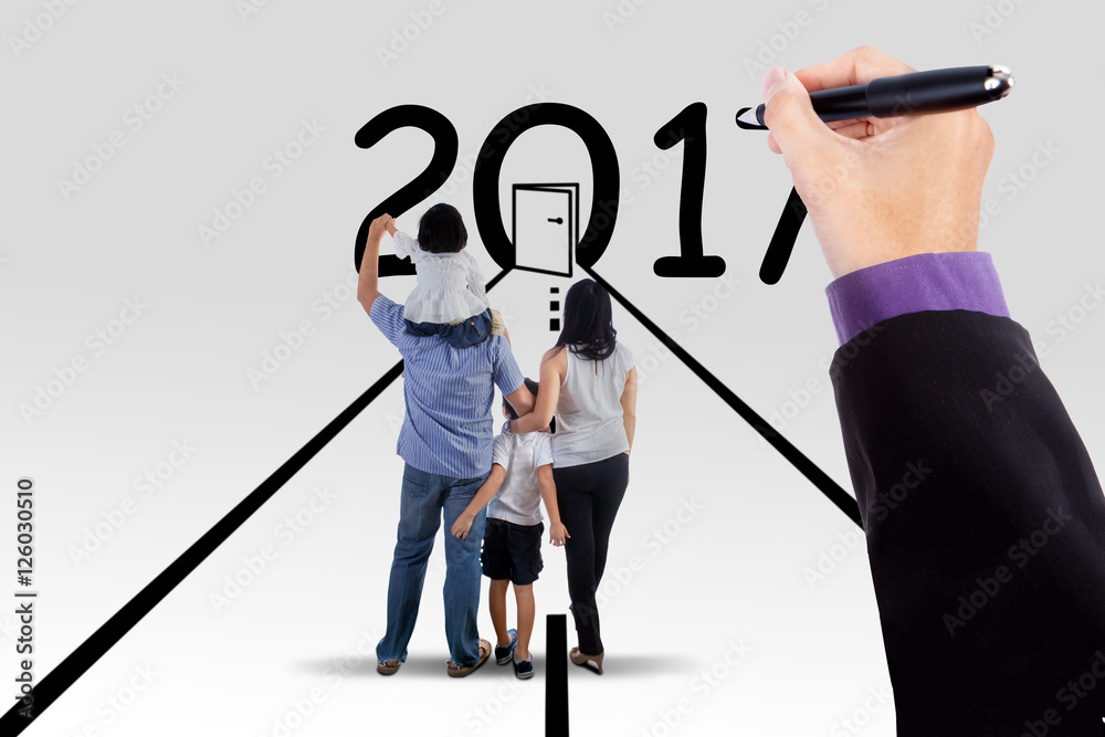 Young family with numbers 2017 and door Young family with numbers 2017 and door