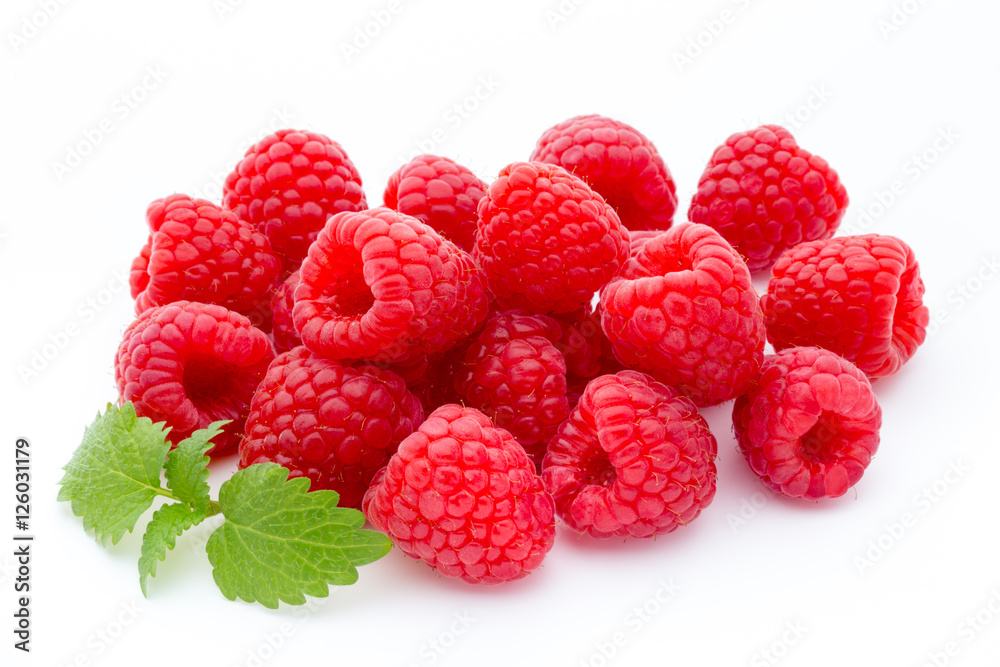 Ripe red raspberries isolated on white background. Ripe red raspberries isolated on white background.