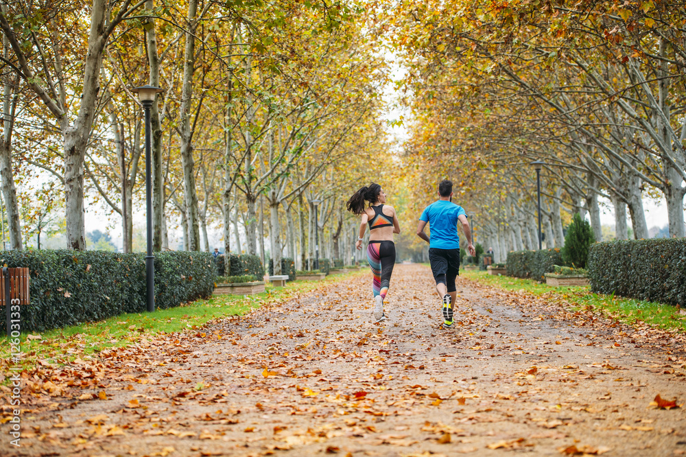 couple running in the park couple running in the park