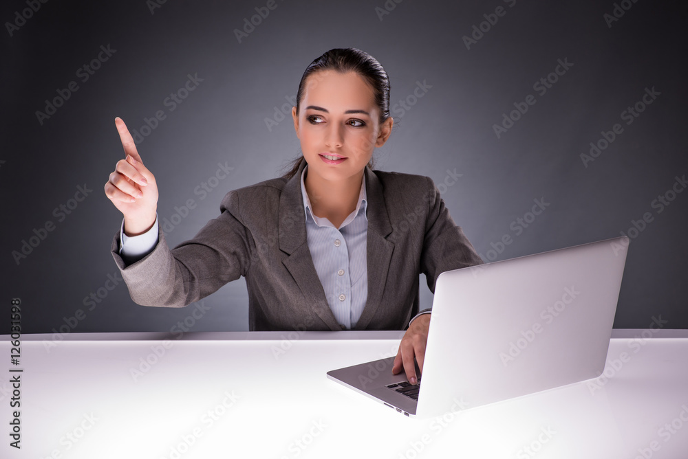Businesswoman with laptop in business concept Businesswoman with laptop in business concept