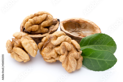 Walnut and walnut kernel isolated on the white background.