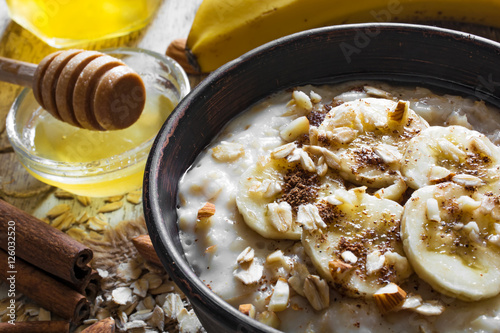 close up of sweet homemade oatmeal porridge. healthy breakfast