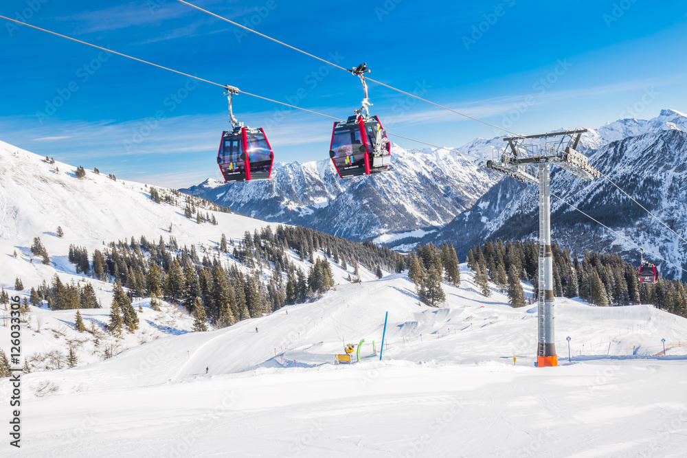 Skiers in cable car enjoying stunning view to Bavarian Alps, Fellhorn, Oberstdorf, Germany Skiers in cable car enjoying stunning view to Bavarian Alps, Fellhorn, Oberstdorf, Germany