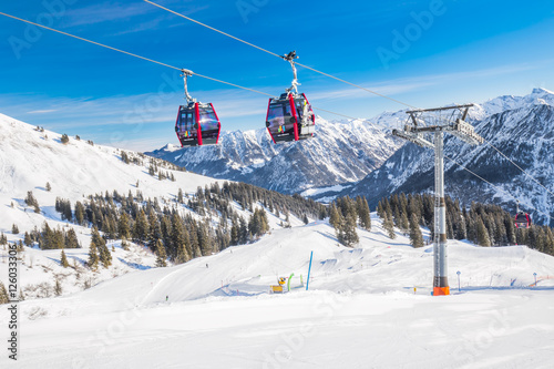  Skiers in cable car enjoying stunning view to Bavarian Alps, Fellhorn, Oberstdorf, Germany photo