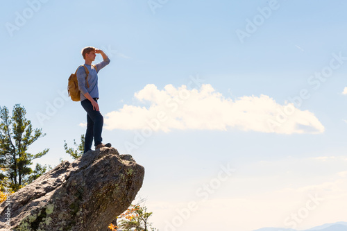 Man walking on the edge of a cliff