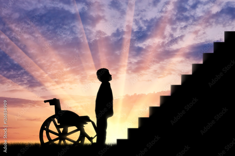 Fototapeta premium Disabled child standing in front of stairs