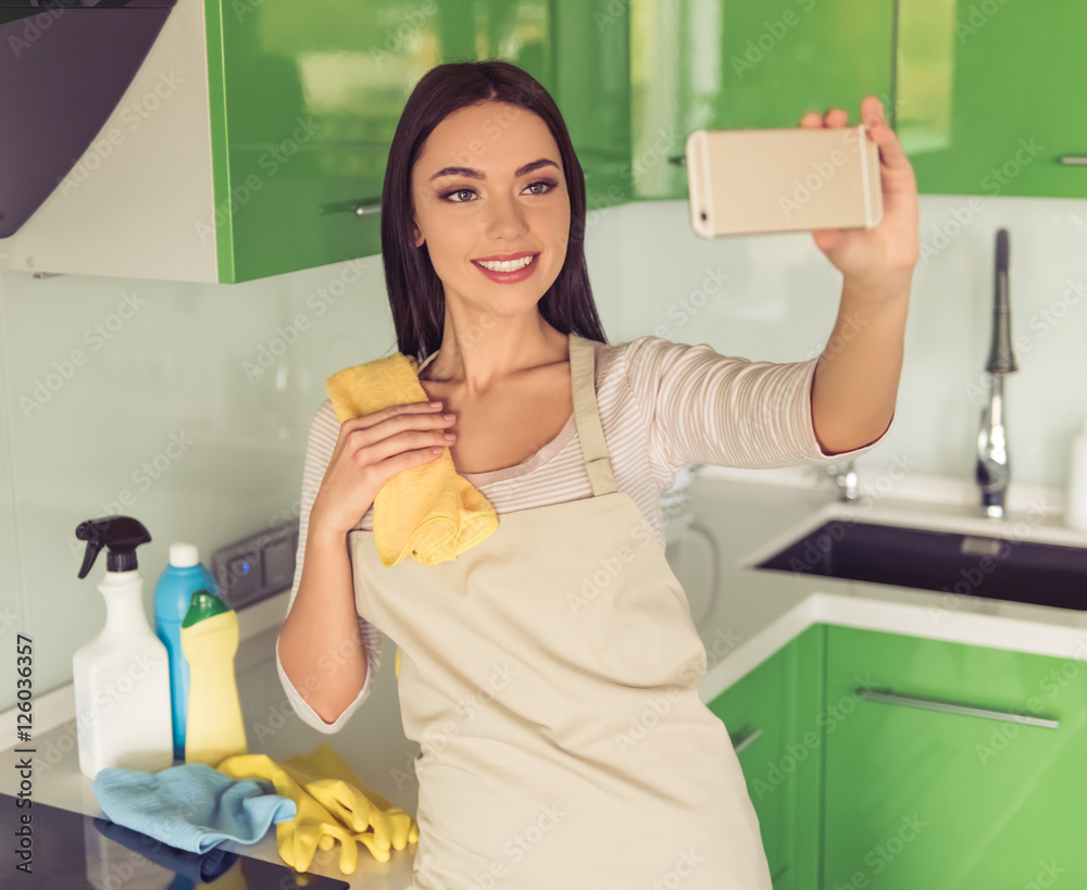 Woman cleaning her kitchen Woman cleaning her kitchen