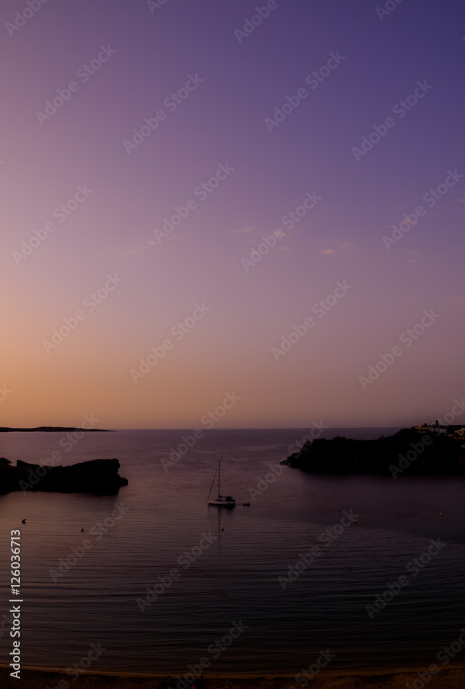 Sunset over bay on Menorca island