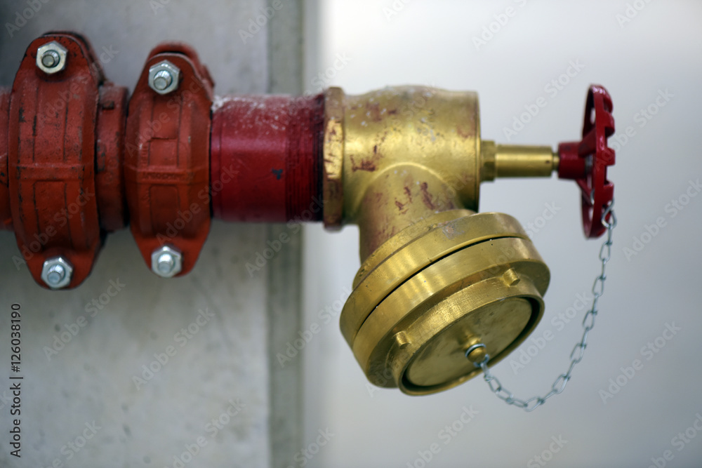 Industrial fire hydrant installed on concrete column Industrial fire hydrant installed on concrete column